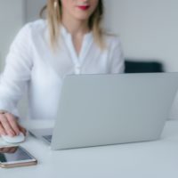 Employer accessing their payroll account on her computer